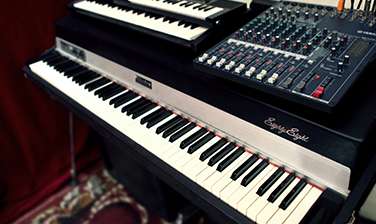 Synthesizers stacked in the recording room